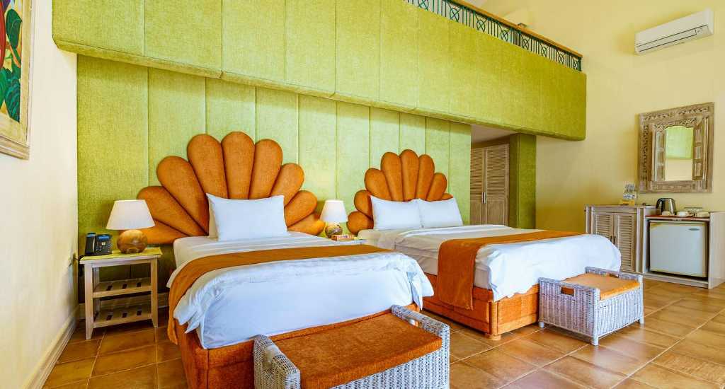 Slaapkamer in Coco Grove Beach Resort Siquijor
